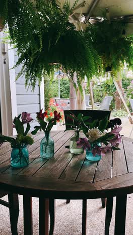 floral arrangement on a wooden patio table