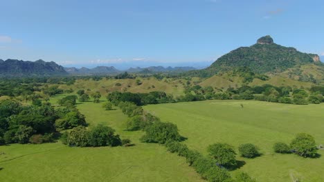 Aerial-long-shot-of-Colombian-nature-reserve-with-lagoons,-plains,-and-forests-between-the-páramo