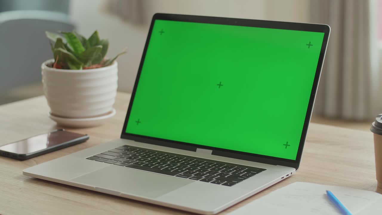 Laptop With Green Mock-Up Screen On The Table, Video In 4K