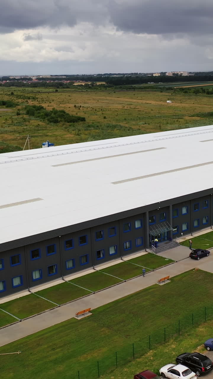 Aerial view of industrial zone. Aerial view of a large industrial estate. Vertical video