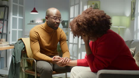 husband supporting frustrated wife at home