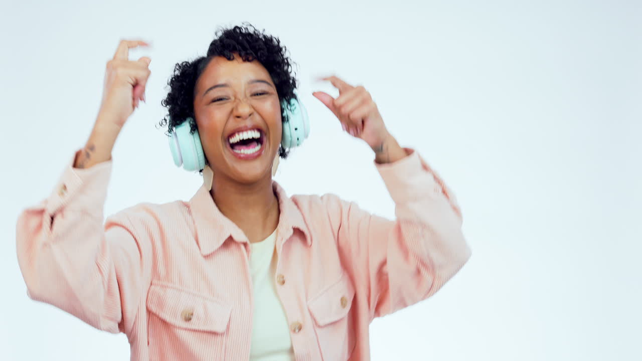 Music, dance and woman with headphones on a white