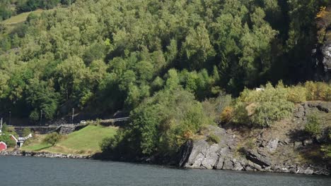 View-over-the-mountainous-forest-shore-slopes-of-Sognefjord-in-Norway