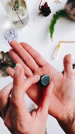 holding a black stone