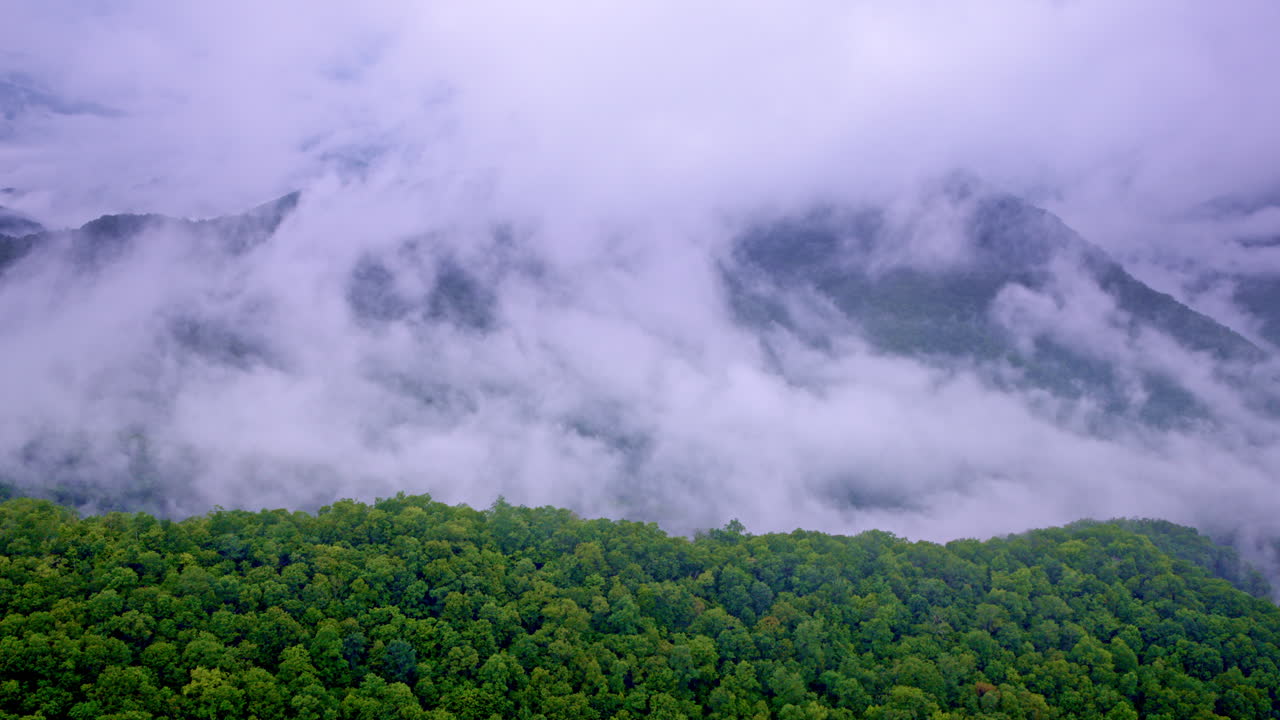 The Great Smoky Mountains disappear into fog in this cinematic drone shot