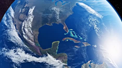 rotating cloudscape revealing lush geography of central america and caribbean islands, illuminated by bright sunlight against dark cosmic background
