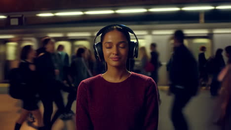 woman listening to music on subway