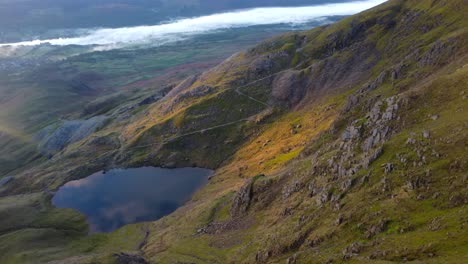 Cinematic-aerial-4K-drone-video-of-glacial-tarn-and-cloud-inversion-over-Coniston-lake---taken-from-Old-Man-of-Coniston