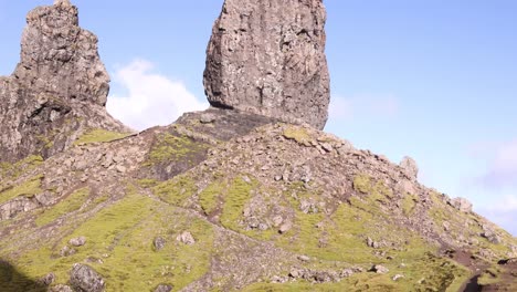 giant rock pillar of old man of storr on a hike on the isle of skye, highlands of scotland