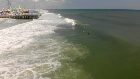 Epic-drone-tracking-shot-of-surfer-riding-a-wave