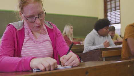 students concentrating in high school class