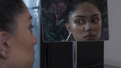 Young-Asian-Indian-Women-Applying-Contouring-Highlighting-Looking-In-Mirror