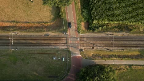 aerial view of a railroad crossing in rural area