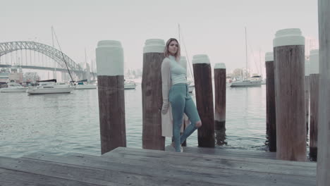 Portrait-of-a-young-attractive-girl-posing-with-Sydney-Harbour-Bridge-background-Beaty-and-health-concept