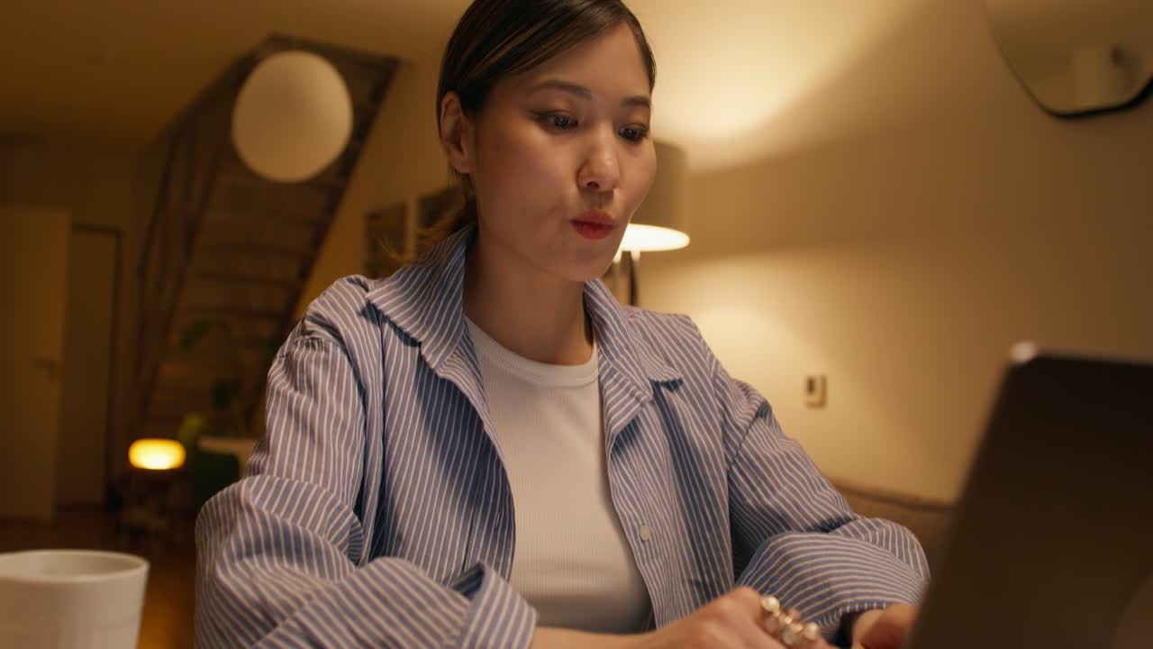 Woman Working from Home at Night