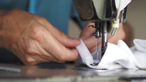 person using a vintage sewing machine