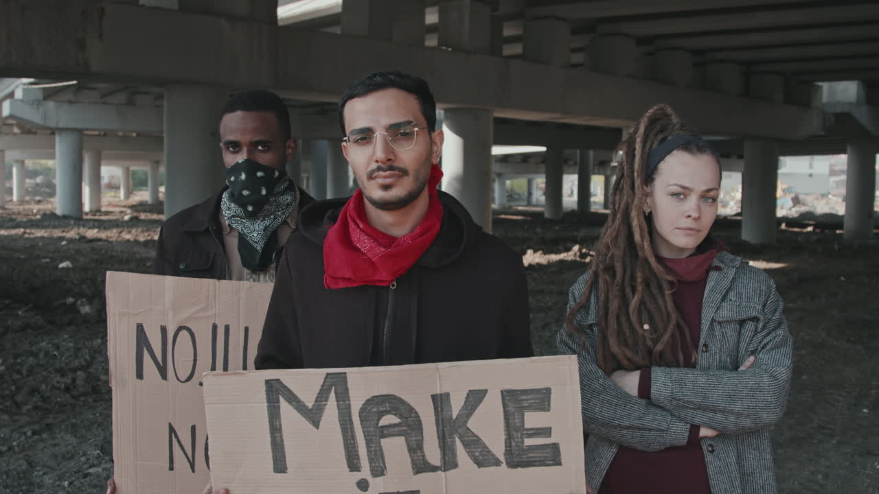 Group of protesters holding signs