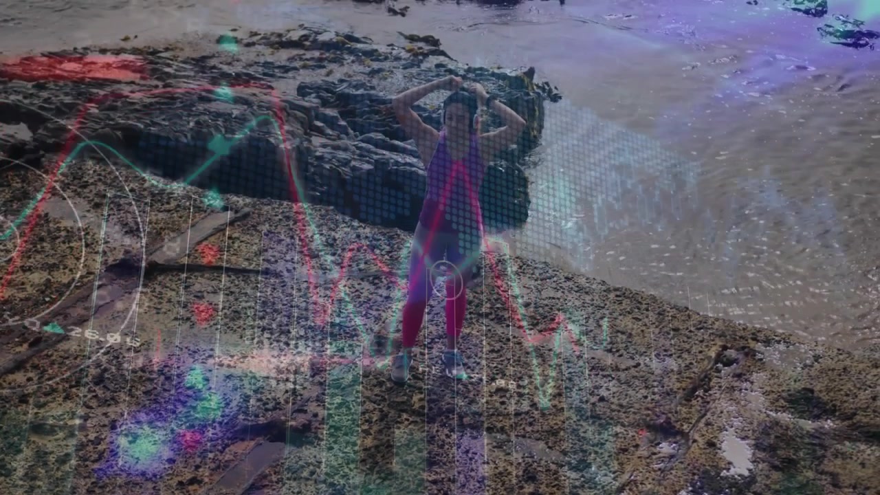 Vertical video: Neon graphics rising, woman in purple top adjusting hair, stepping on rock shore