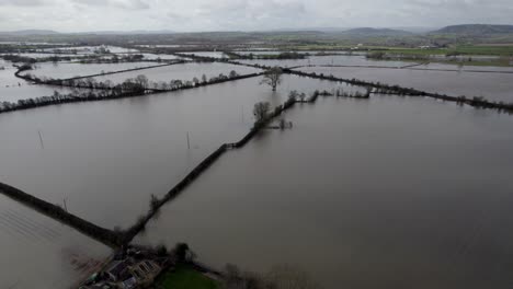 Flooded-farm-fields-after-storm-in-England-aerial-panning-shot-4K