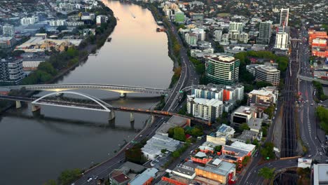 Aerial-View-Of-Train-Crossing-The-Merivale-Bridge-Over-Brisbane-River-In-Australia---drone-shot