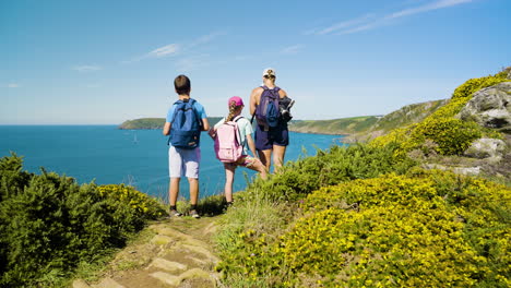 family hiking trip by the coast