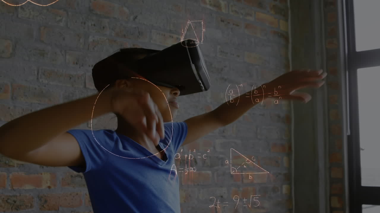 Boy wearing a virtual reality headset beside a window