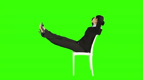 Business-woman-relaxing-on-a-chair-with-legs-up