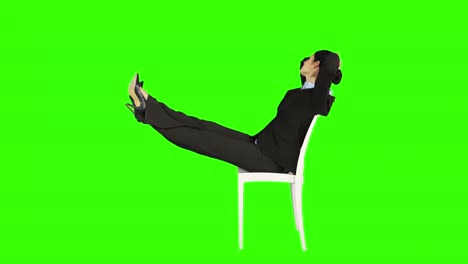 business woman relaxing on a chair with legs up