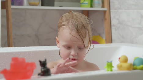 little girl taking a bath