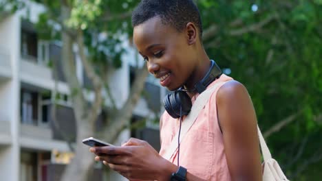 woman using mobile phone in the city 4k