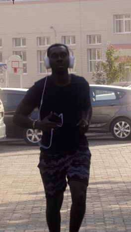 man running on a city street