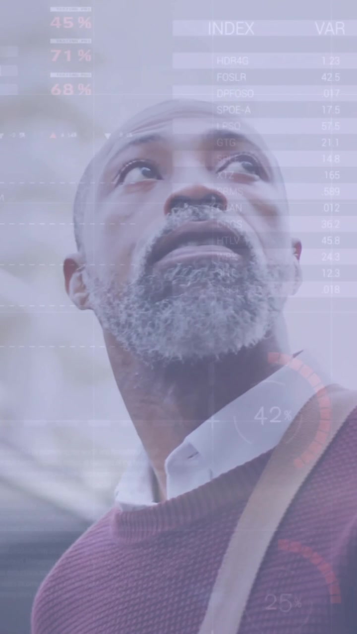 Animation of diagrams and data processing over african american man walking in city