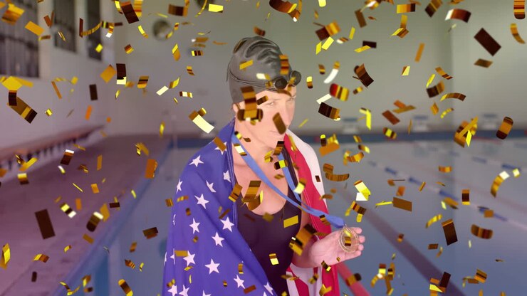 Animation von Konfetti und der Flagge der USA über einer kaukasischen Schwimmerin mit Medaille