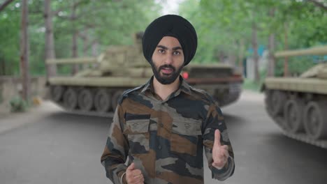 serious sikh indian army man talking to someone