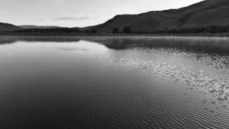 flying-over-a-large-lake-black-and-white-AERIAL-DOLLY