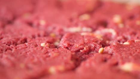 close-up of red velvet cake batter with white chocolate chips