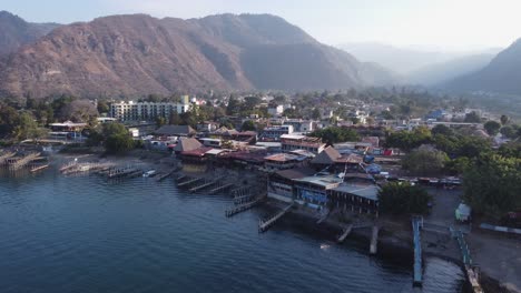 aerial retreats from mountain village on lake atitlan in guatemala