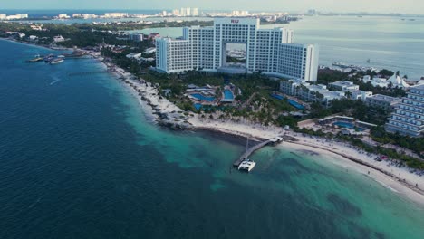 4K-Drone-Flight-Over-Luxury-Beach-Resorts-On-Beach-Coast-In-Cancun,-Mexico