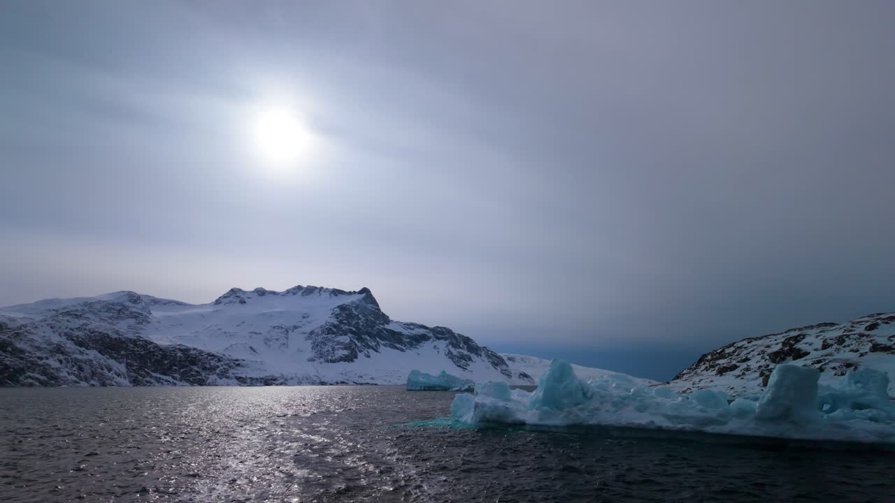 Icy coastal landscape near Nuuk with melting icebergs in Greenland
