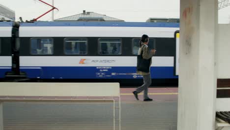 woman walking on train platform