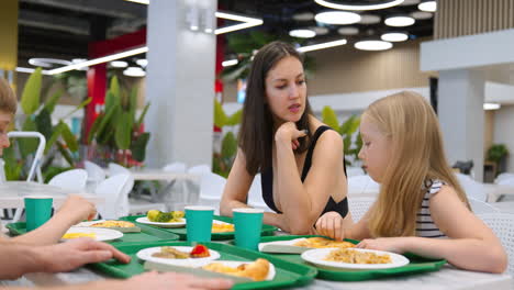 family dining at a food court