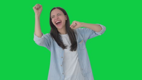 happy indian girl dancing and enjoying green screen