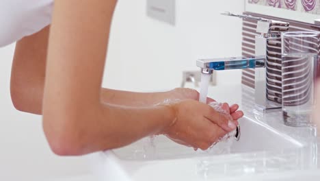 Water-pouring-over-woman-hands