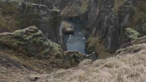 fjadrargljufur canyon and surrounding landscape, iceland. tilt-up reveal