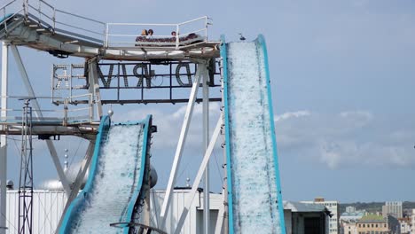 people enjoying a log flume ride