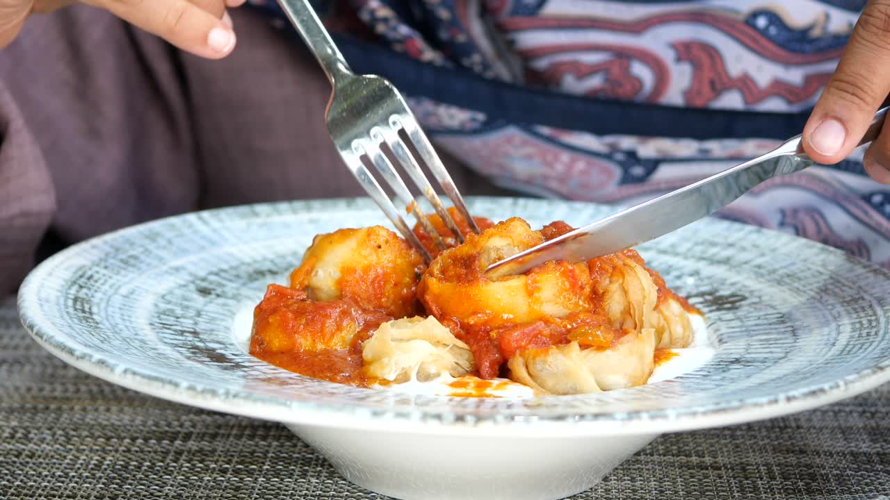 Woman eating dumplings