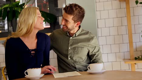 Couple-discussing-over-menu-card-4k