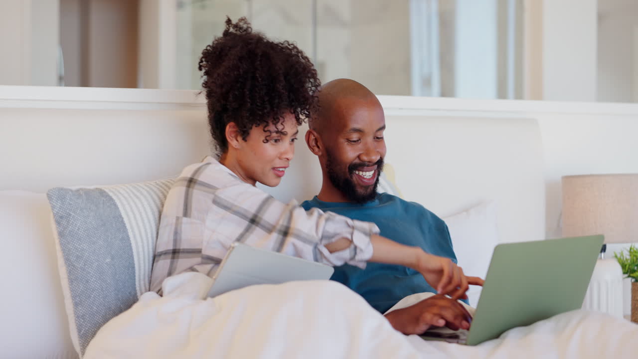 Bedroom, home and couple with a laptop
