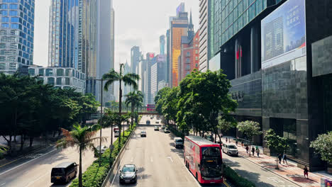 light traffic on gloucester road, hong kong under sunny blue skies