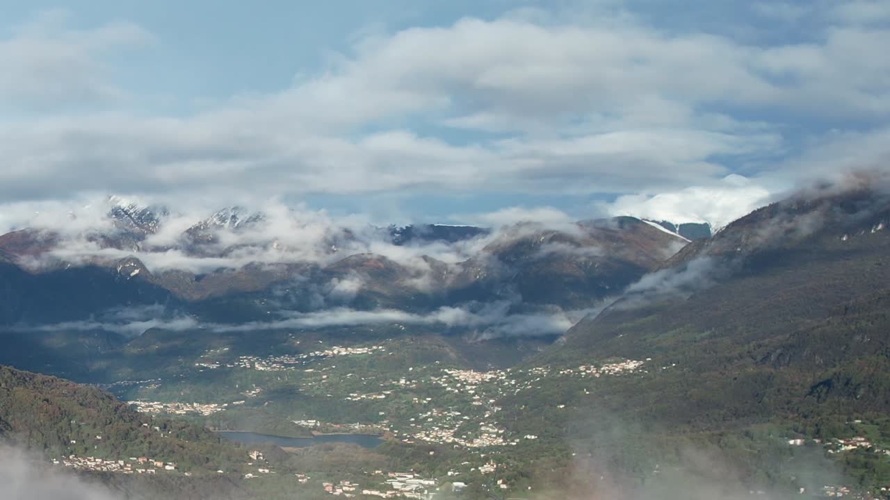 Scenic drone view of the Alps in Italy showcasing lush valleys